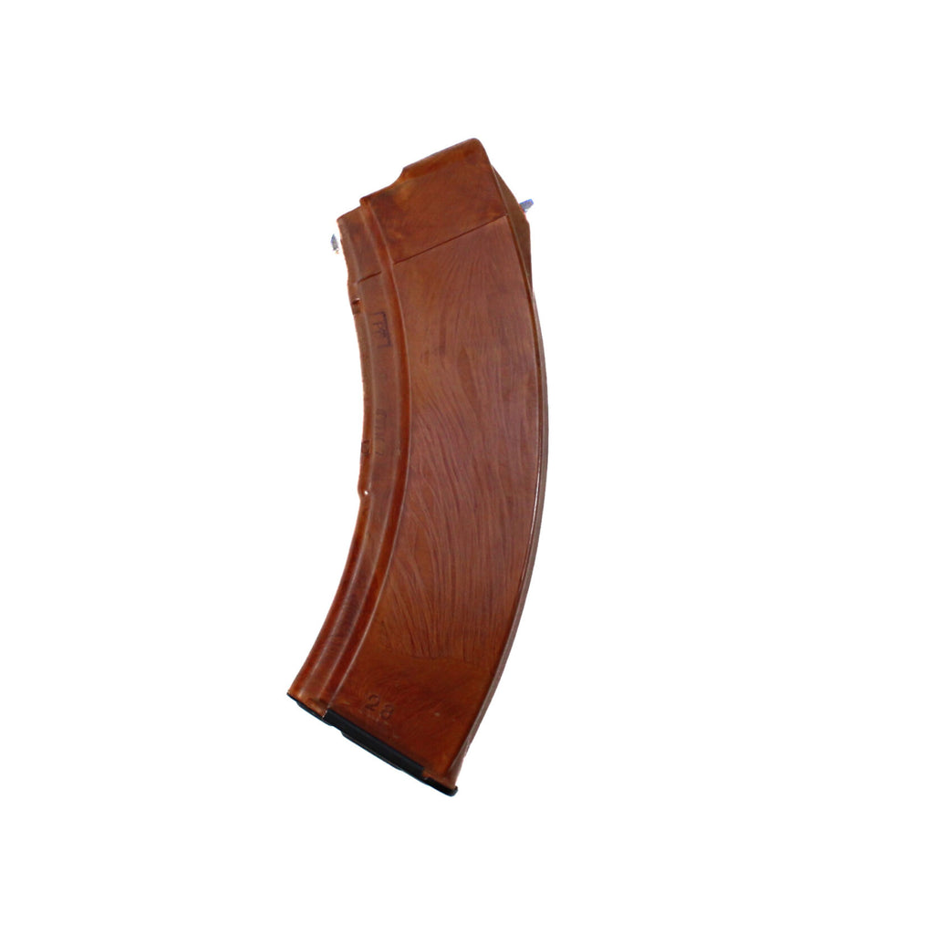 Side view of a Russian Bakelite AK-47 30-round magazine for 7.62x39mm rifles, featuring a classic orange marbled texture.