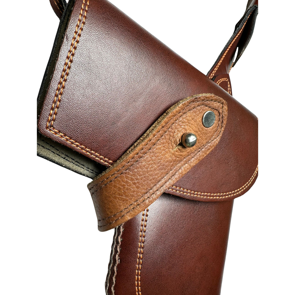 Side profile of a handcrafted brown leather tactical holster case for 9mm and 45 caliber pistols.