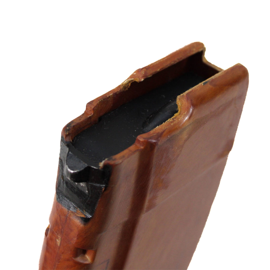 Side profile of a vintage Russian Bakelite AK-47 30-round magazine in 7.62x39 caliber with a classic orange finish.